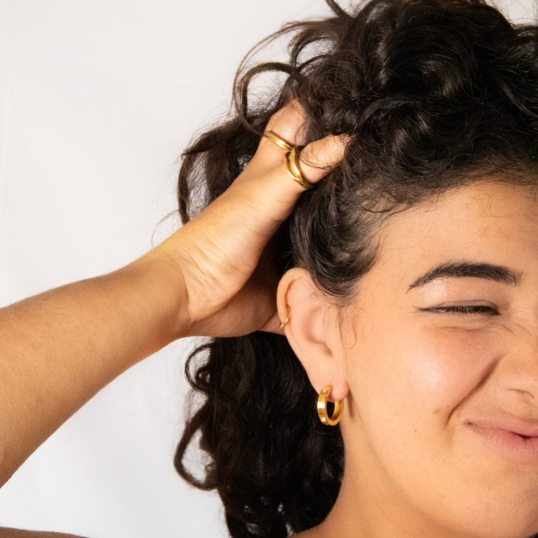 Sustainable gold and silver hoop earrings with sparkle.