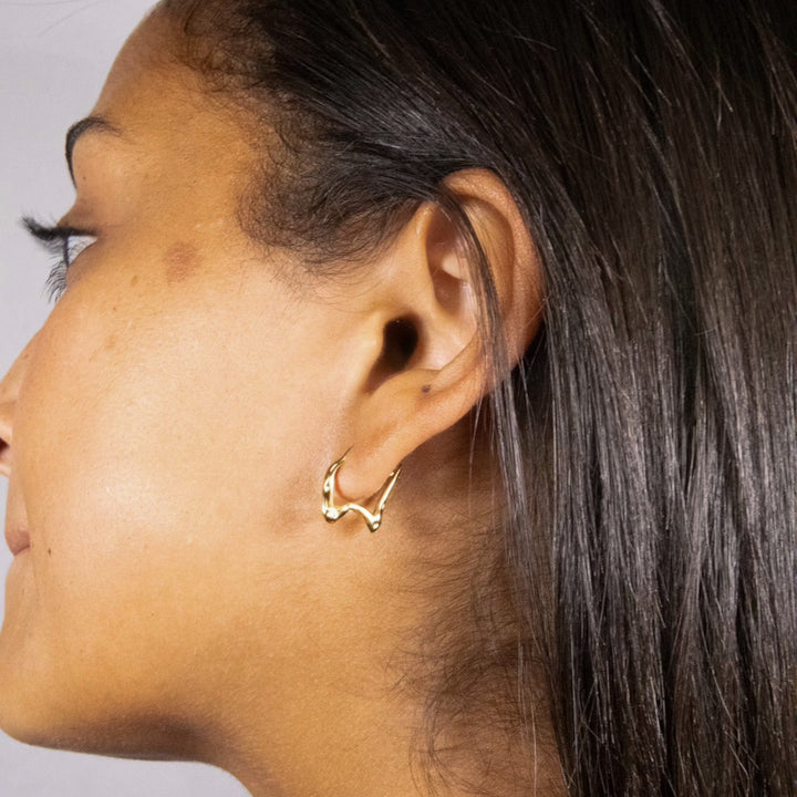 Irregular shaped gold and silver hoops with cubic zirconia. Comfortable to sleep in. Made from recycled gold. Gift.