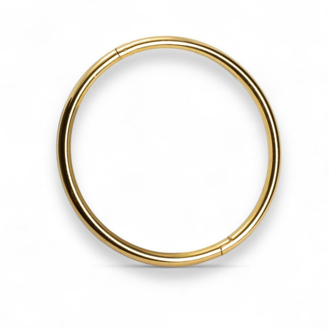 A gold bangle or a silver bangle with a hinge to fit every wrist. Sustainable. Anti tarnish. The perfect gift.