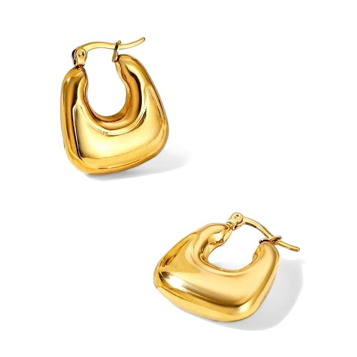 A pair of delicate yet bold hoop earrings with a smooth finish, vintage but modern. Made from recycled gold.