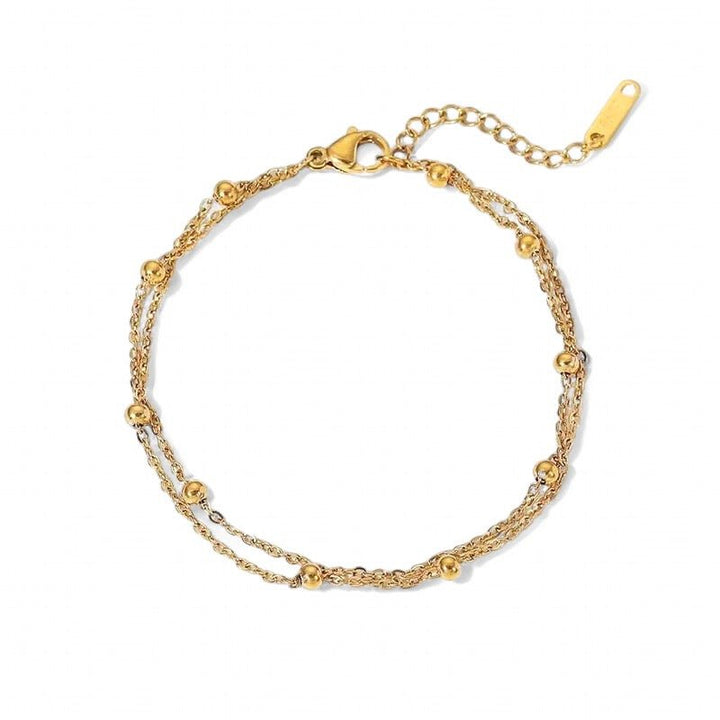 A gold and silver beaded bracelet with a double chain and gold balls and adjustable closure. Made from recycled gold. Gift.