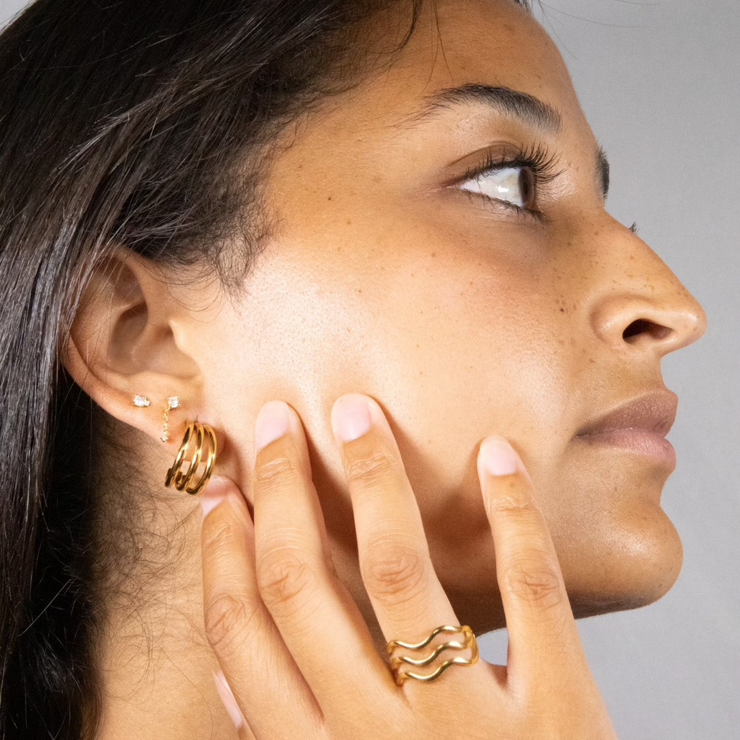 gold triple ring in a wave pattern

gouden drievoudige ring in golfpatroon

triple bague en or à motif de vagues