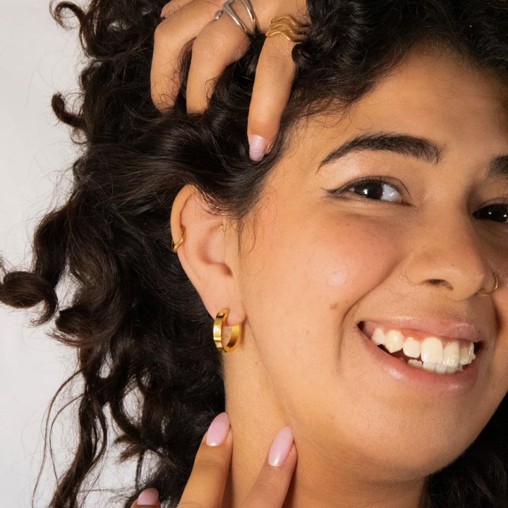 Sustainable gold and silver hoop earrings with sparkle.