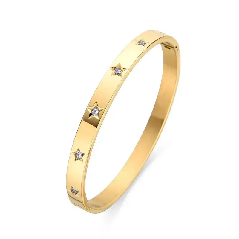 A gold bangle with sparkly Cubic Zirconia, the oval-shaped design fits comfortably around the wrist.