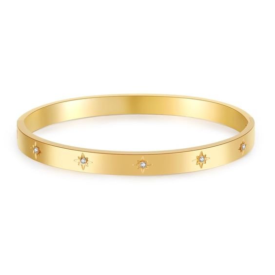 Star bangle with sparkle and hinged opening. Curved to fit the wrist. Made from recycled gold and silver.