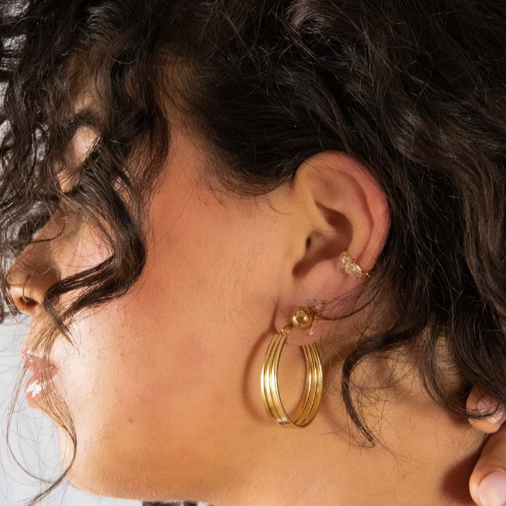 Hoop earrings in gold designed to make a statement.Light-weight earrings.Made from recycled gold.Anti-tarnish. Perfect gift.