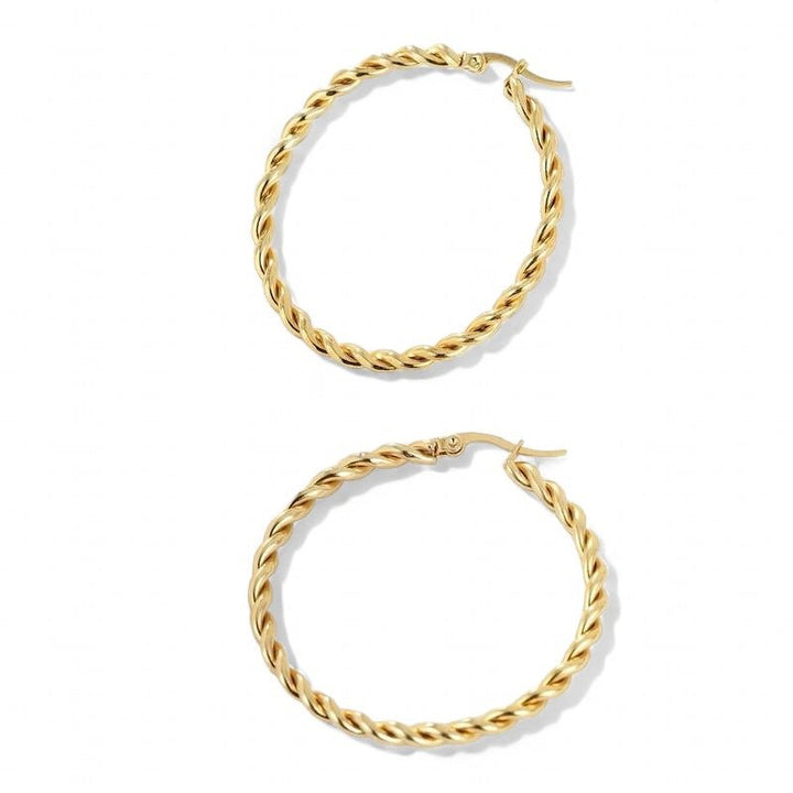 Large twisted hoops in gold


Grandes créoles torsadées en or

Grote gedraaide hoepels in goud